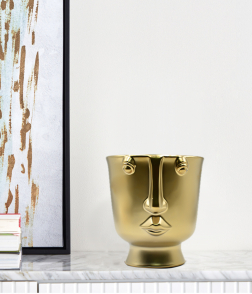 مزهرية لون ذهبي على شكل وجه