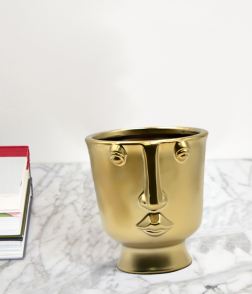 مزهرية لون ذهبي على شكل وجه